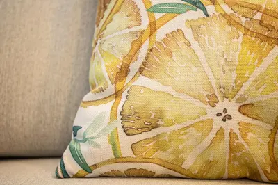 a cushion with a flower pattern on a couch at Referta Apartamento T1 in Prazeres