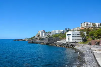 a view of a body of water with buildings at Sol do Lido 2 in Funchal