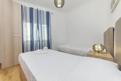 a bedroom with two beds and a window at B81 - Casa do Outeiro Westcoast Home in Vila do Bispo