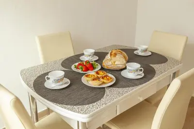 a table with cups and plates of food on it at B81 - Casa do Outeiro Westcoast Home in Vila do Bispo