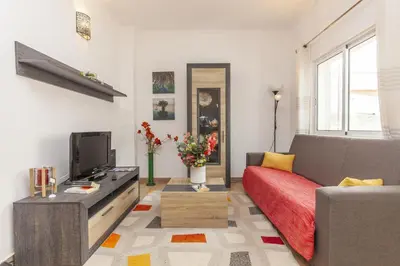 a living room with a couch and a tv at B81 - Casa do Outeiro Westcoast Home in Vila do Bispo