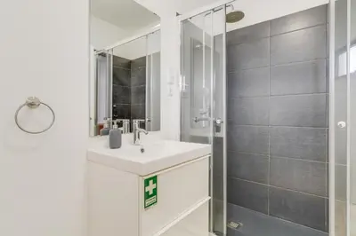 a bathroom with a sink and a shower at Yellow Rose by AH in Funchal