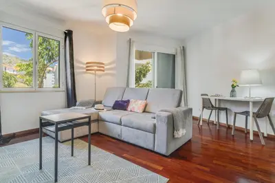 a living room with a couch and a table at Yellow Rose by AH in Funchal