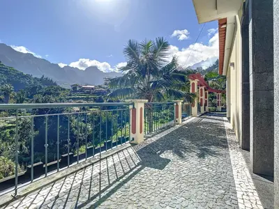 a balcony of a house with a view of the mountains at Mountain View Villa by Atlantic Holiday in São Vicente