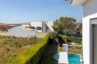 a view of a swimming pool from a house at The Green Sheep Sagres in Sagres