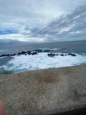 a view of the ocean with rocks and waves at Tranquilidade in Estreito da Calheta