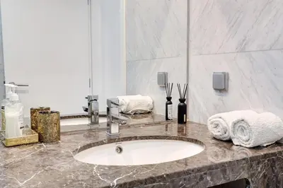 a bathroom with a sink and a shower at Apartamento Forum View Studio in Funchal