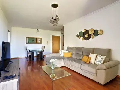 a living room with a couch and a table at Vista Atlântica by LovelyStay in Caniço