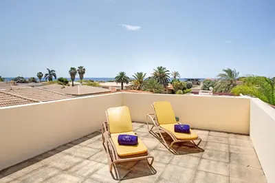 two chairs on a balcony with a view of the ocean at Retiro Praia in Campo de Baixo