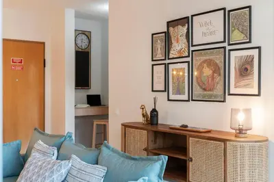 a living room with a couch and a table with pillows at Comboio I by An Island Apart in Funchal