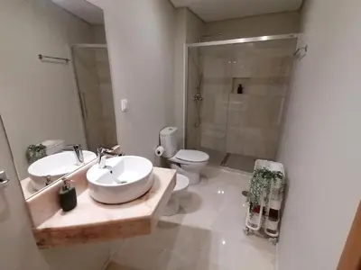 a bathroom with a sink and a toilet and a shower at Apartments Madeira Barreirinha in Funchal