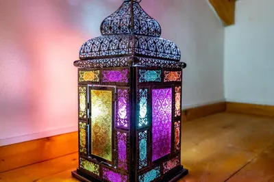 a colorful lantern is sitting on a wooden floor at Casa Joia by Seewest in Bensafrim