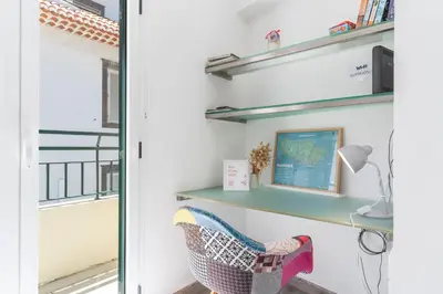 a white bedroom with a bed with pillows at Cosy Central by Atlantic Holiday in Funchal