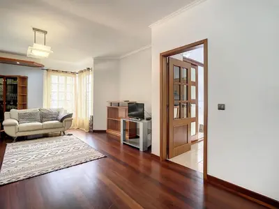 a living room with a couch and a television at Milagres Apartment by Atlantic Holiday in Machico