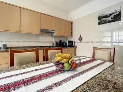 a bowl of bananas on a table in a kitchen at Milagres Apartment by Atlantic Holiday in Machico
