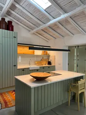 a kitchen with a counter with a bowl on it at Casa da Oliveira - Monte Branco in Aljezur