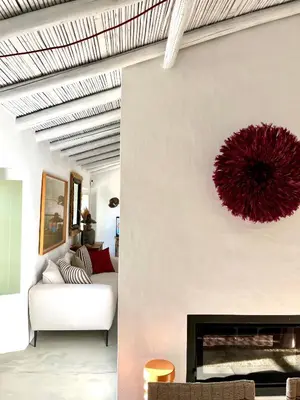 a living room with a couch and a fireplace at Casa da Oliveira - Monte Branco in Aljezur