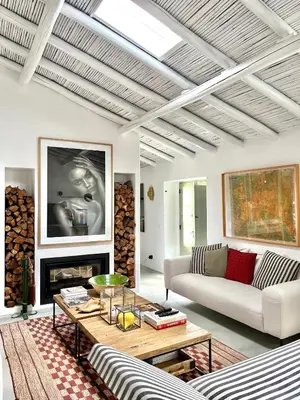 a living room with a couch and a table at Casa da Oliveira - Monte Branco in Aljezur