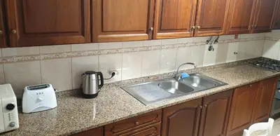a kitchen counter with a sink and a toaster at Casa da Conceição - Bay View Spot in Funchal