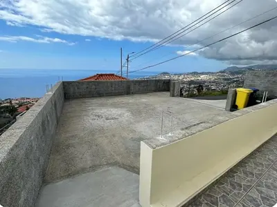 a view of the ocean from the roof of a house at Casa da Conceição - Bay View Spot in Funchal