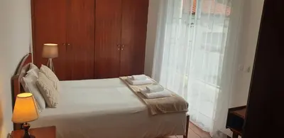 a bedroom with a bed with two towels on it at Casa da Conceição - Bay View Spot in Funchal