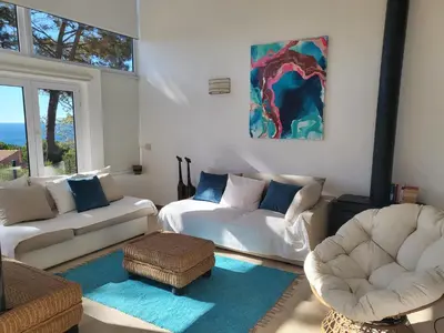 a living room with two chairs and a couch at Lighthouse Apartment in Luz