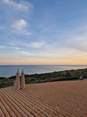 a view of the ocean from the roof of a house at Lighthouse Apartment in Luz