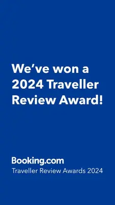 a blue sign that says weve won a traveler review award at Lighthouse Apartment in Luz