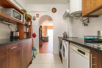 a bedroom with a large white bed and a window at apartment with breathtaking view in Burgau