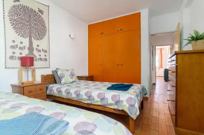 a living room with a couch and a large window at apartment with breathtaking view in Burgau