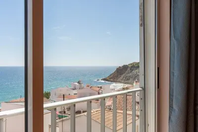 a living room with a couch and a table at apartment with breathtaking view in Burgau
