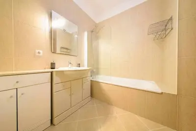 a bathroom with a sink and a bath tub at Garajau Ocean View in Caniço