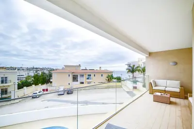 a balcony with a view of a city at WIOLA SeaView Apartment by MOJE Holiday in Lagos