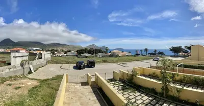 a parking lot with a view of the ocean at Maria da Vinha Porto Santo Beach House in Porto Santo