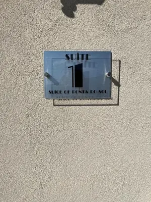 a sign on a wall that reads suite stick of furniture at Slice of ponta do sol Room 1 in Ponta do Sol