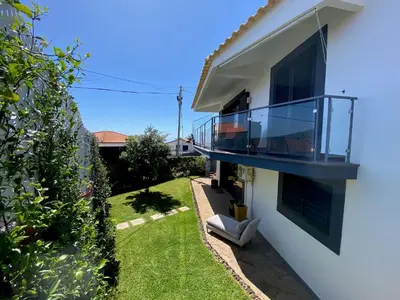 a view of a house with a balcony at Villa Madeira island in Caniço