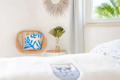 a bedroom with a table and a chair and a window at Villa Sound of the Sea by Portugal Collection in Aljezur