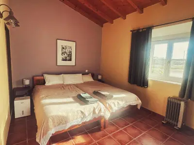 a bathroom with a shower and a sink at Casa Presente Guesthouse in Carrapateira