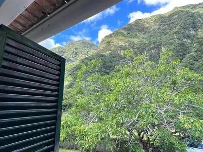 a view from a window of a mountain at Casa da Nogueira in Porto Moniz