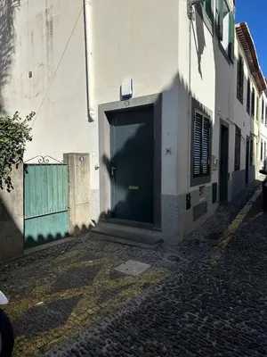 a door on the side of a building at Casa Lugos in Funchal