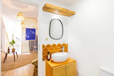 a bathroom with a sink and a mirror at Casa Lugos in Funchal