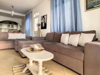 a living room with a couch and a table at Naya Beach House by LovelyStay in Paul do Mar