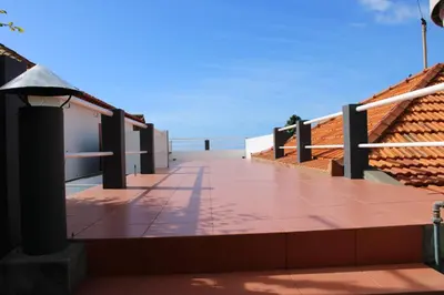 a balcony with a view of the ocean at Moradia Stephanie in Funchal