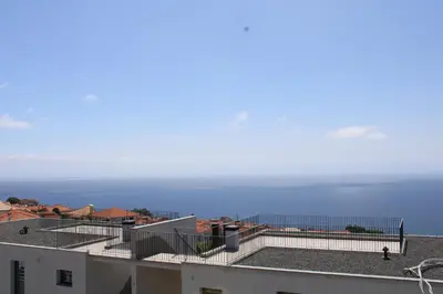 a view of the ocean from the roof of a building at Moradia Stephanie in Funchal