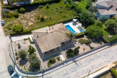 a swimming pool in front of a house at Good Vibes Villa in Aljezur