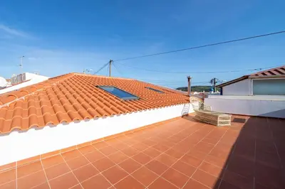 a roof of a house with a red tile roof at Peaceful, spacious & stylish, a real home! in Budens