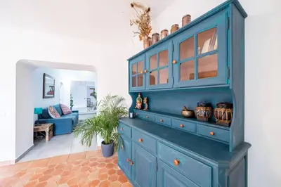 a large blue cabinet in a living room at Peaceful, spacious & stylish, a real home! in Budens