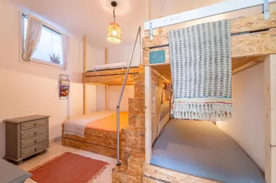 a couple of bunk beds in a tiny house at Villa O Altinho Carrapateira in Carrapateira