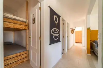 a hallway with bunk beds in a room at Villa O Altinho Carrapateira in Carrapateira