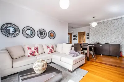 a living room with a white couch and a table at Home to Stay by Homie in Funchal